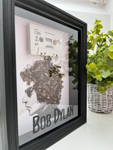 Bob Dylan’s Hair is Blowing In the Wind.