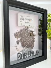 Bob Dylan’s Hair is Blowing In the Wind.